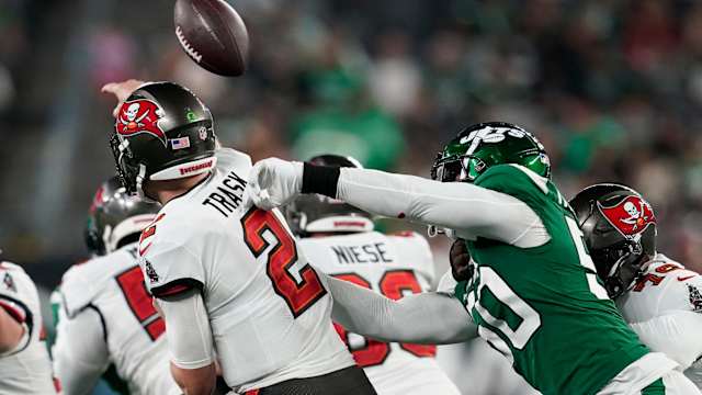Jets' DE Jalyn Holmes strips Bucs' QB Kyle Trask in a preseason game